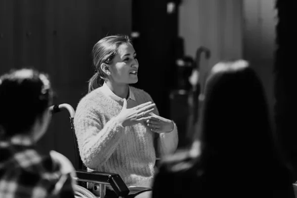 Woman speaking about neuroinclusivity, black and white